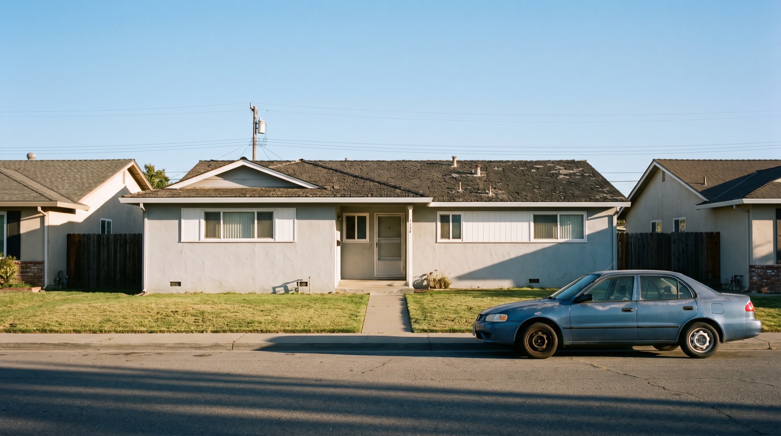 An ordinary 1960s Bay Area tract ranch house on a quiet street, the kind home buying companies make offers on